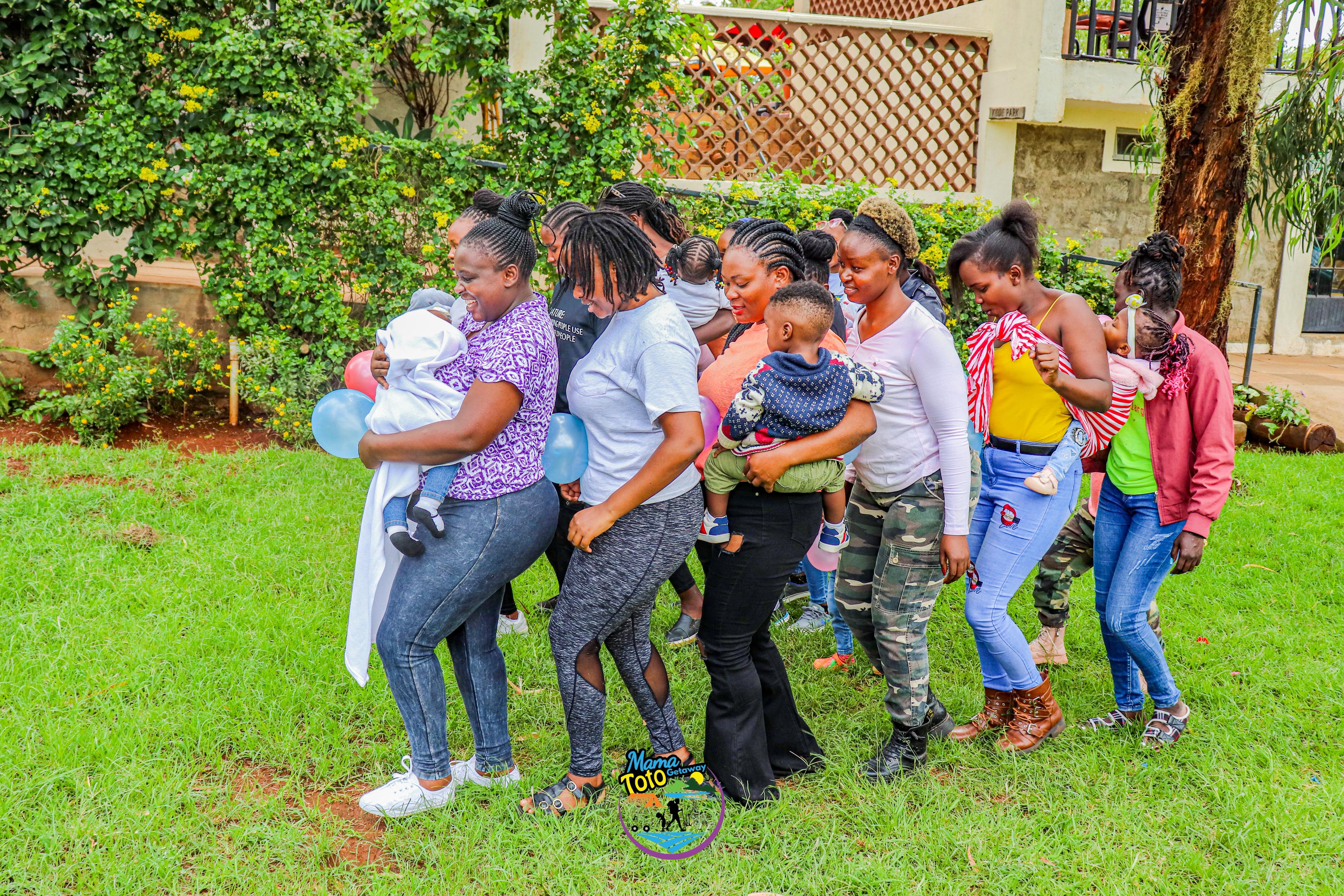 Moms and kids playing with ballons